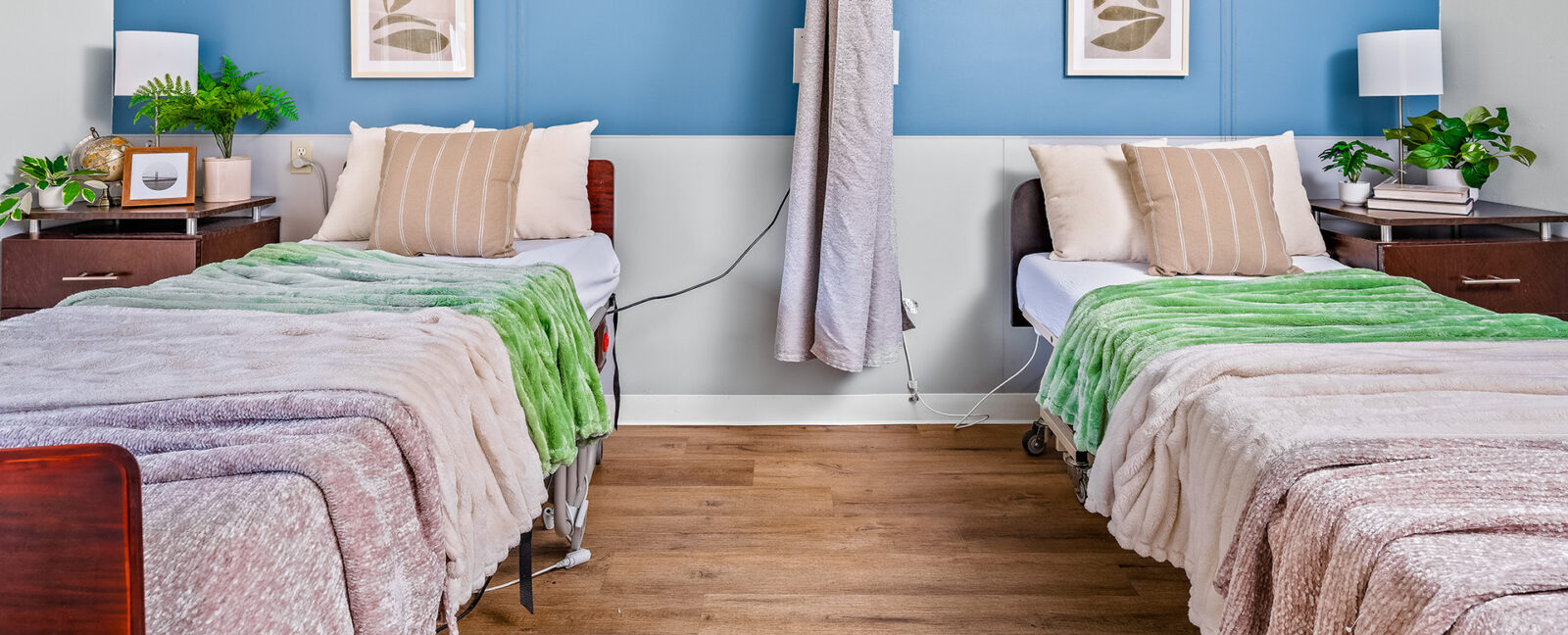 two neatly made resident beds